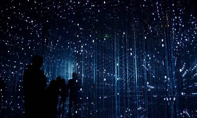 future concept image with people standing amid blue lights