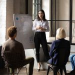 woman giving presentation to colleagues