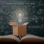 open box on book with lightbulb floating above it