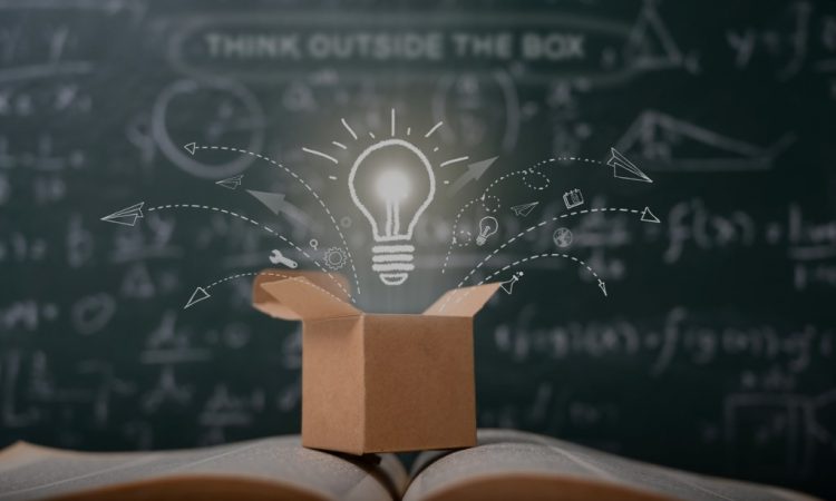 open box on book with lightbulb floating above it