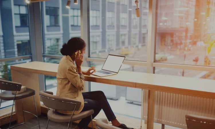 woman on laptop in coworking space