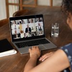 woman on video call at kitchen table