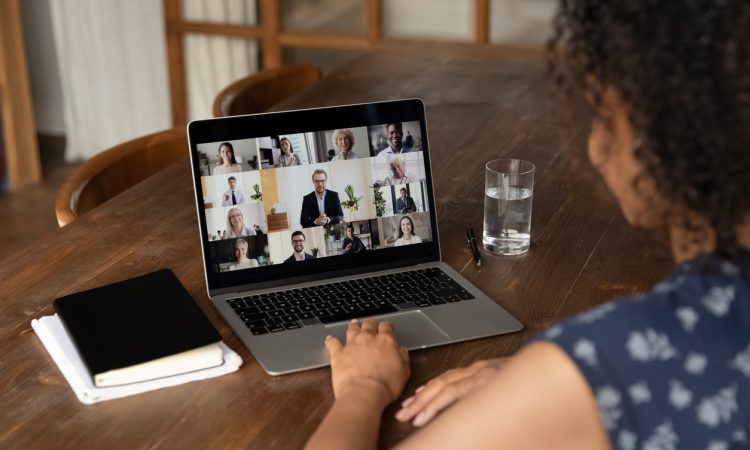 woman on video call at kitchen table