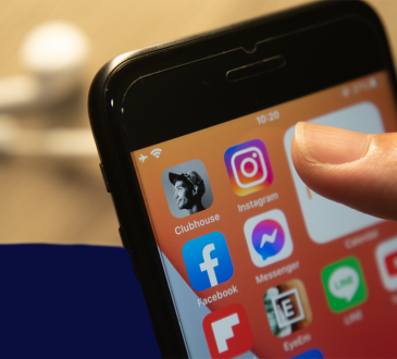 Clubhouse app among other social media icons on smartphone screen