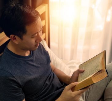 man reading book