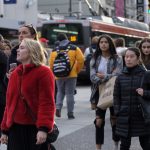 crowd walking on toronto street