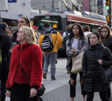 crowd walking on toronto street