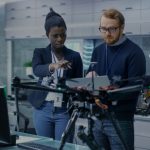 team of engineers working on drone project in laboratory