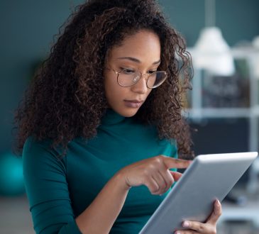 Woman using tablet in office.