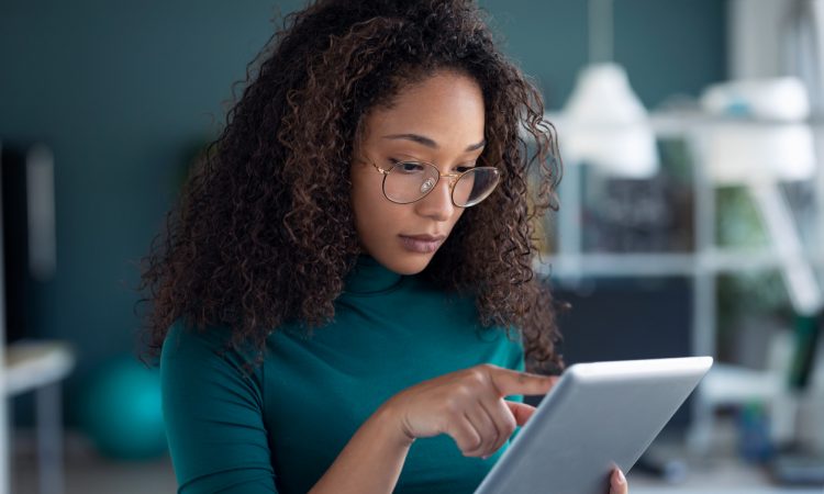Woman using tablet in office.