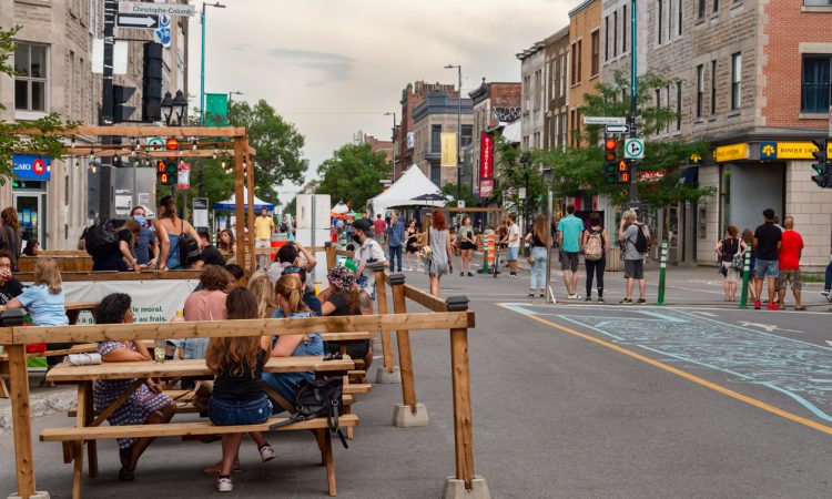 Busy Montreal street filled with pedestrians.