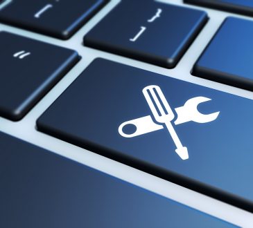 Keyboard with crossing tools icon on enter key.
