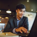 Man using laptop at work.
