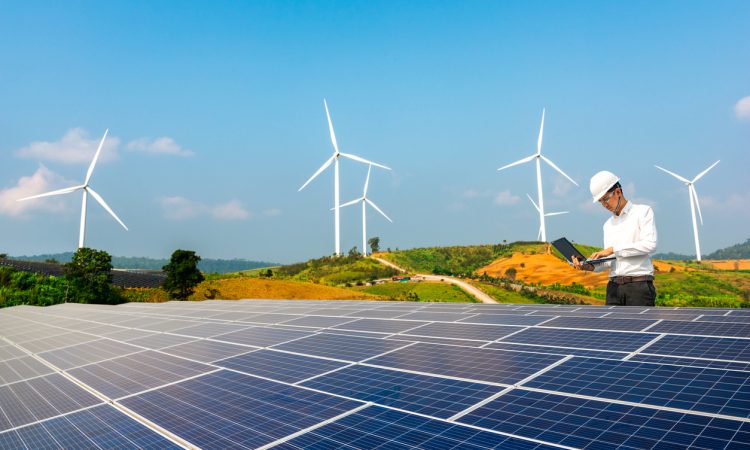 Electrical engineers are using laptops to monitor the operation of the solar rooftop