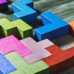Interlocking colourful geometric blocks.