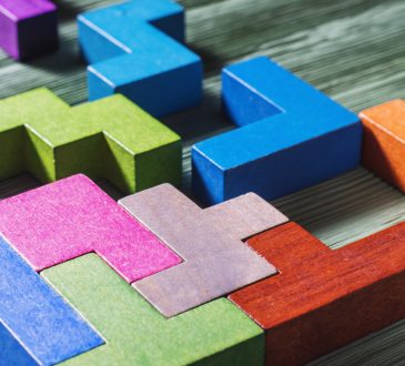 Interlocking colourful geometric blocks.