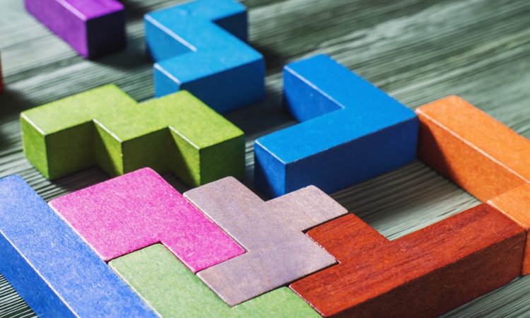 Interlocking colourful geometric blocks.