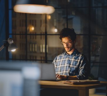 Man working at desk late at night