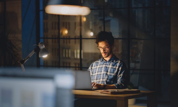 Man working at desk late at night