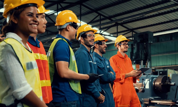 Workers wearing hard hats in industrial setting