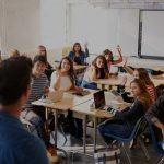 Teacher and high school students in classroom