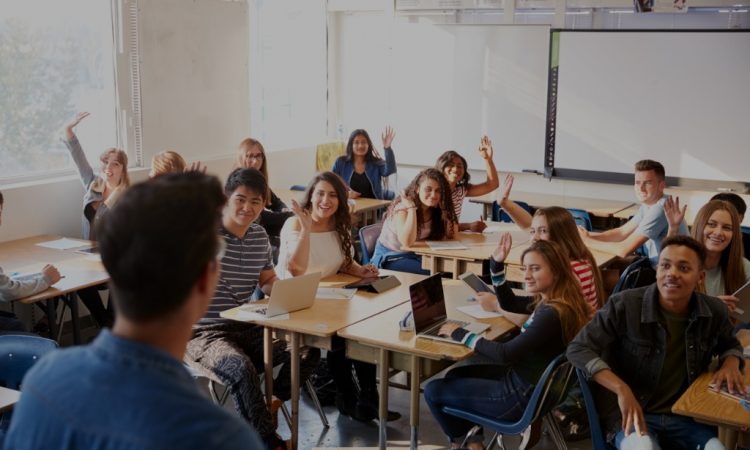 Teacher and high school students in classroom