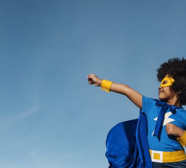 Kid wearing superhero costume