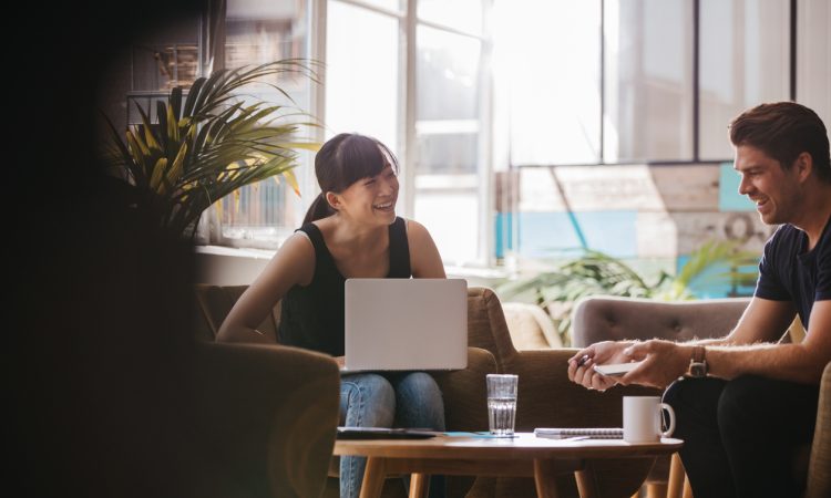 Man and woman laughing and talking
