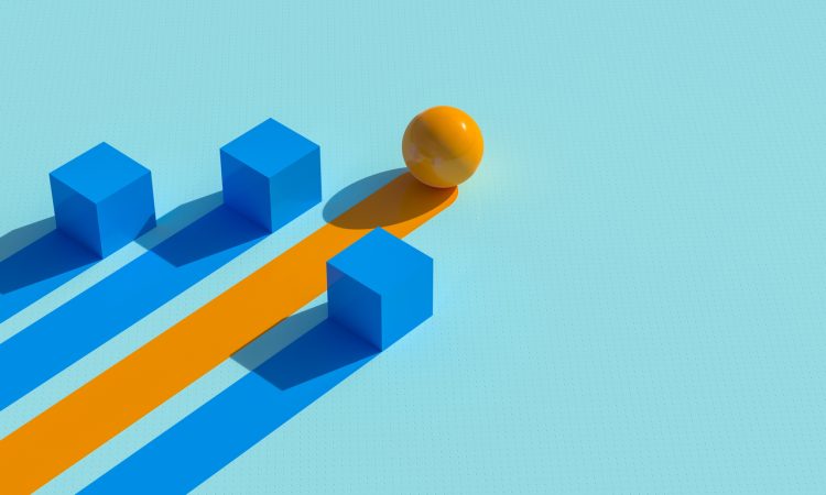 Two cubes and sphere with lines trailing behind as representation of winning business strategy