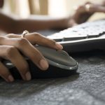 Woman hand with Computer Mouse close up