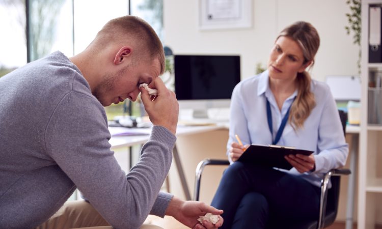 Woman meeting with man who is crying