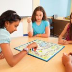 Students in a classroom playing an educational game