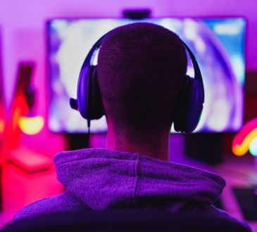 Young man playing video games on computer