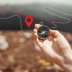 Hand holding compass