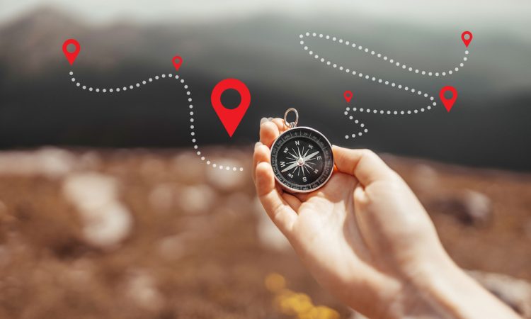 Hand holding compass