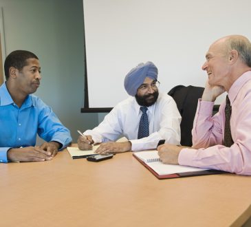 Multiethnic group of businesspeople in a meeting at office