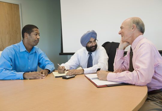 Multiethnic group of businesspeople in a meeting at office