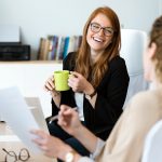 Two women talking in office