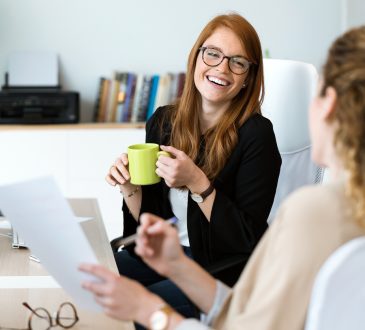 Two women talking in office