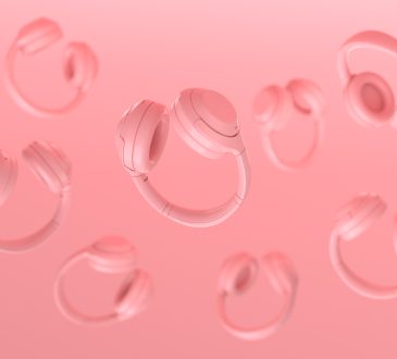 Floating headphones on pink background