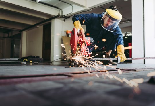 Craftsman Welding is Cutting Steel Work in Fabrication Workshop