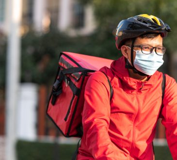 Food delivery driver on bike.