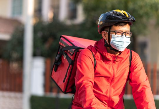 Food delivery driver on bike.