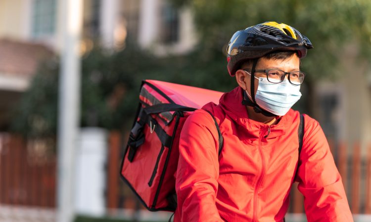 Food delivery driver on bike.