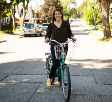 Woman on bike on residential street