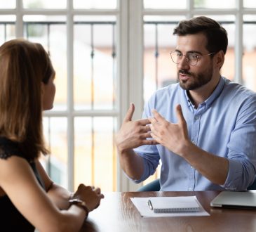 Man and woman in meeting at work.