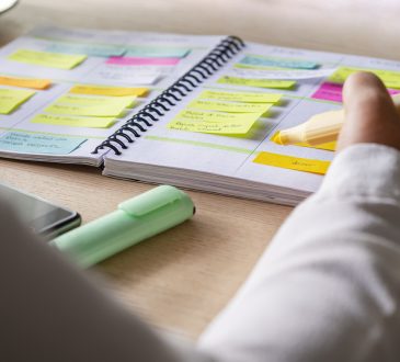 Close-up of hand writing in agenda