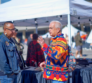 Two indigenous men talking to each other at Toronto city Hall’s Nathan Phillips Square for National Day for Truth and Reconciliation.