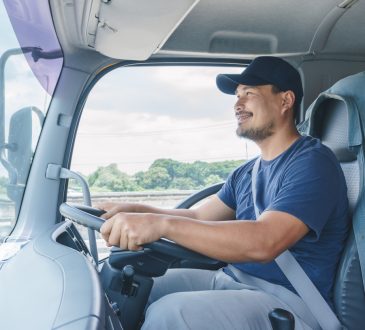 Man driving transport truck