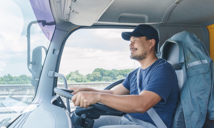Man driving transport truck